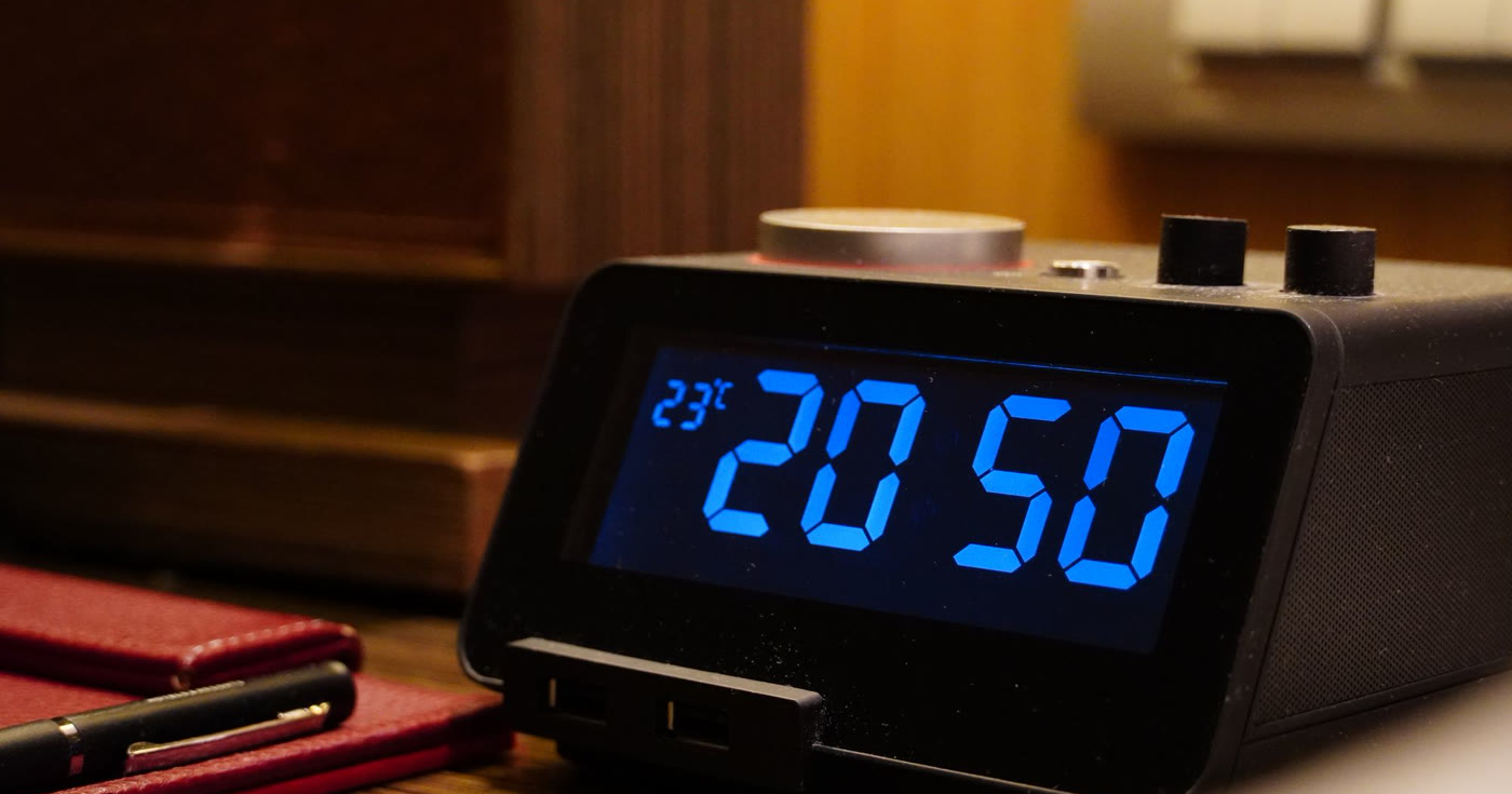 A digital timer on a wooden table