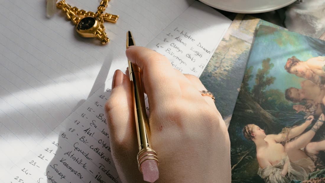 A person writing notes in a notebook